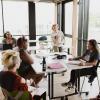 Students chat in classroom.